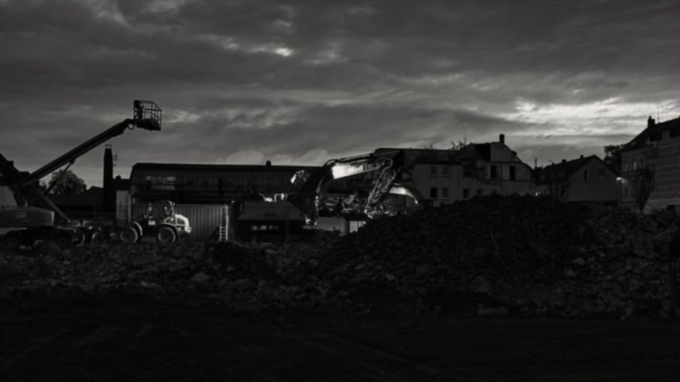Crushed concrete and MOT type 1 stockpile in a UK demolition yard, graded ready to list